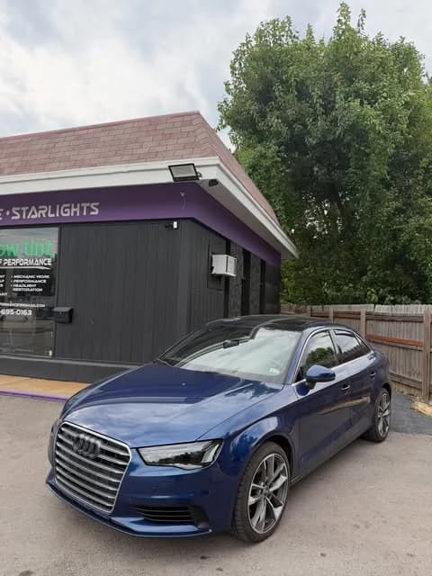 Blue Audi outside the shop